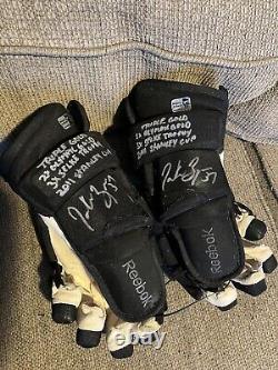 Boston bruins patrice bergeron 2 game used/worn gloves 4 inscriptions each glove
